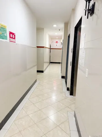 a view of storage and utility room with refrigerator