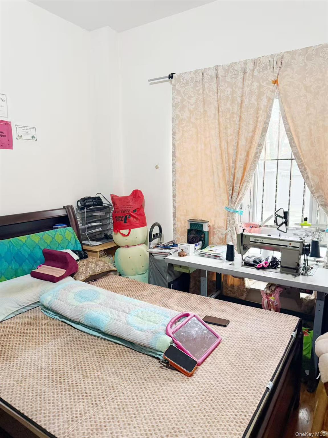 8510 Elmhurst Avenue, Unit 1C Queens, NY 11373 - Photo 5 of 9 a living room with furniture and a couch