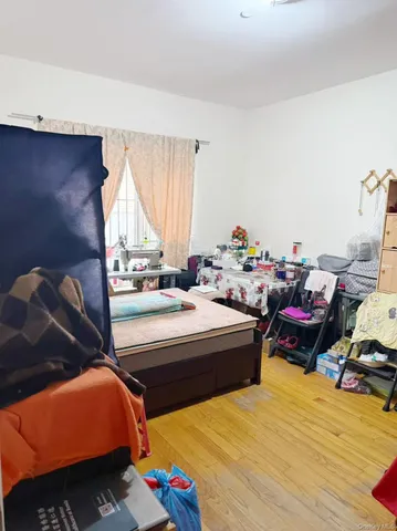 a bed room with a bed and a chair