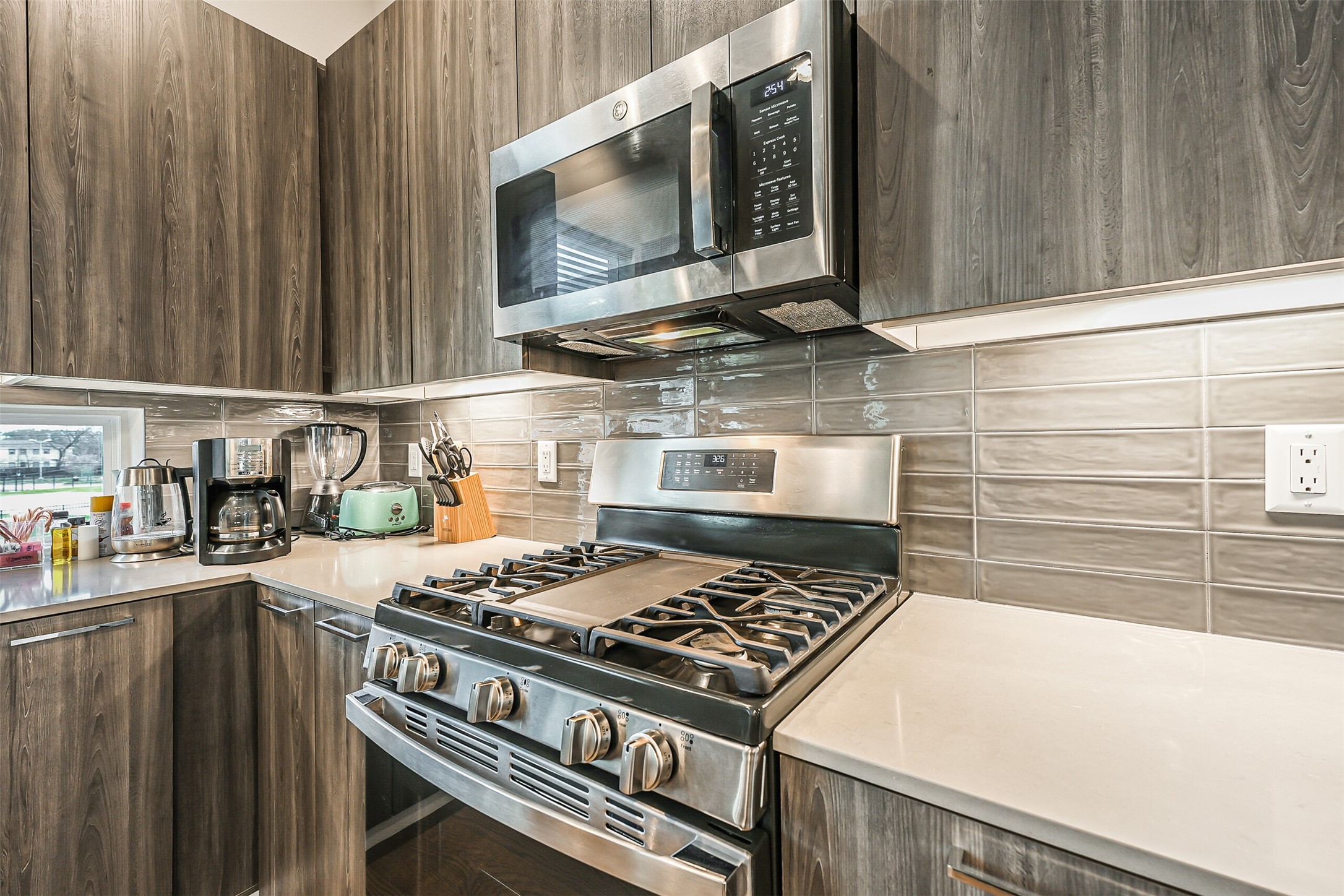 2136 Dennis Street Houston, TX 77004 - Photo 11 of 49 a kitchen with a stove and a microwave