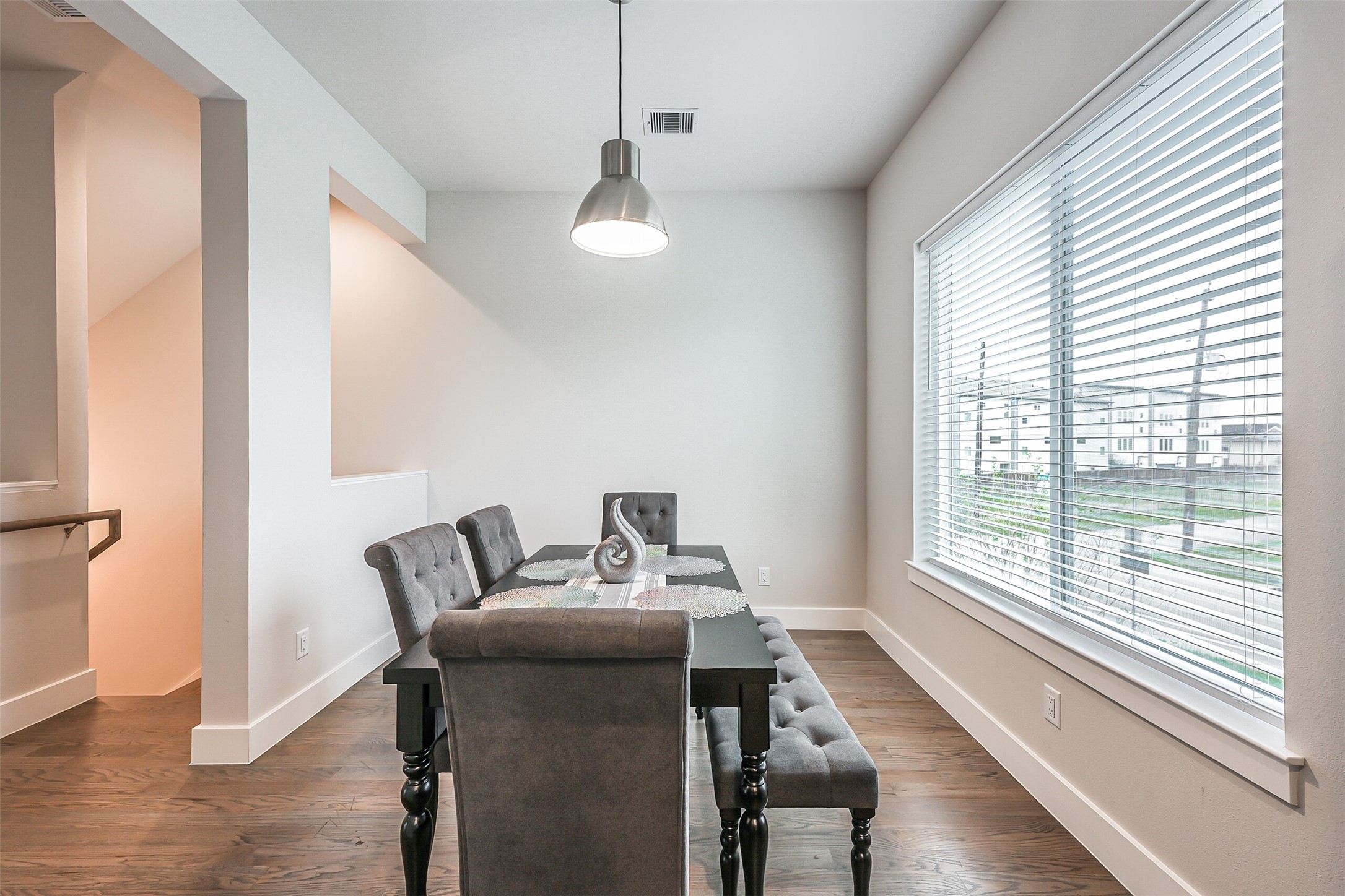 2136 Dennis Street Houston, TX 77004 - Photo 17 of 49 a view of a room with furniture wooden floor and windows