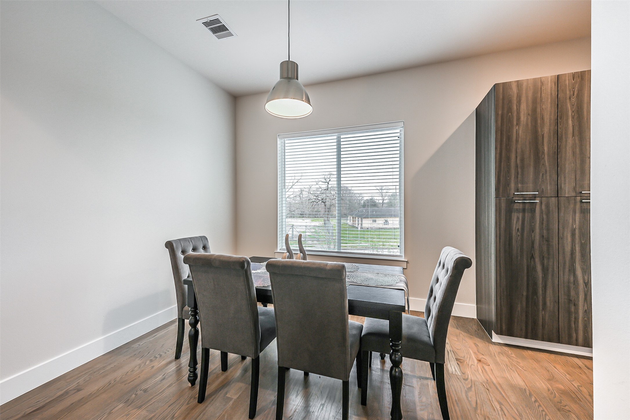 2136 Dennis Street Houston, TX 77004 - Photo 19 of 49 a view of a dining room with furniture window and wooden floor