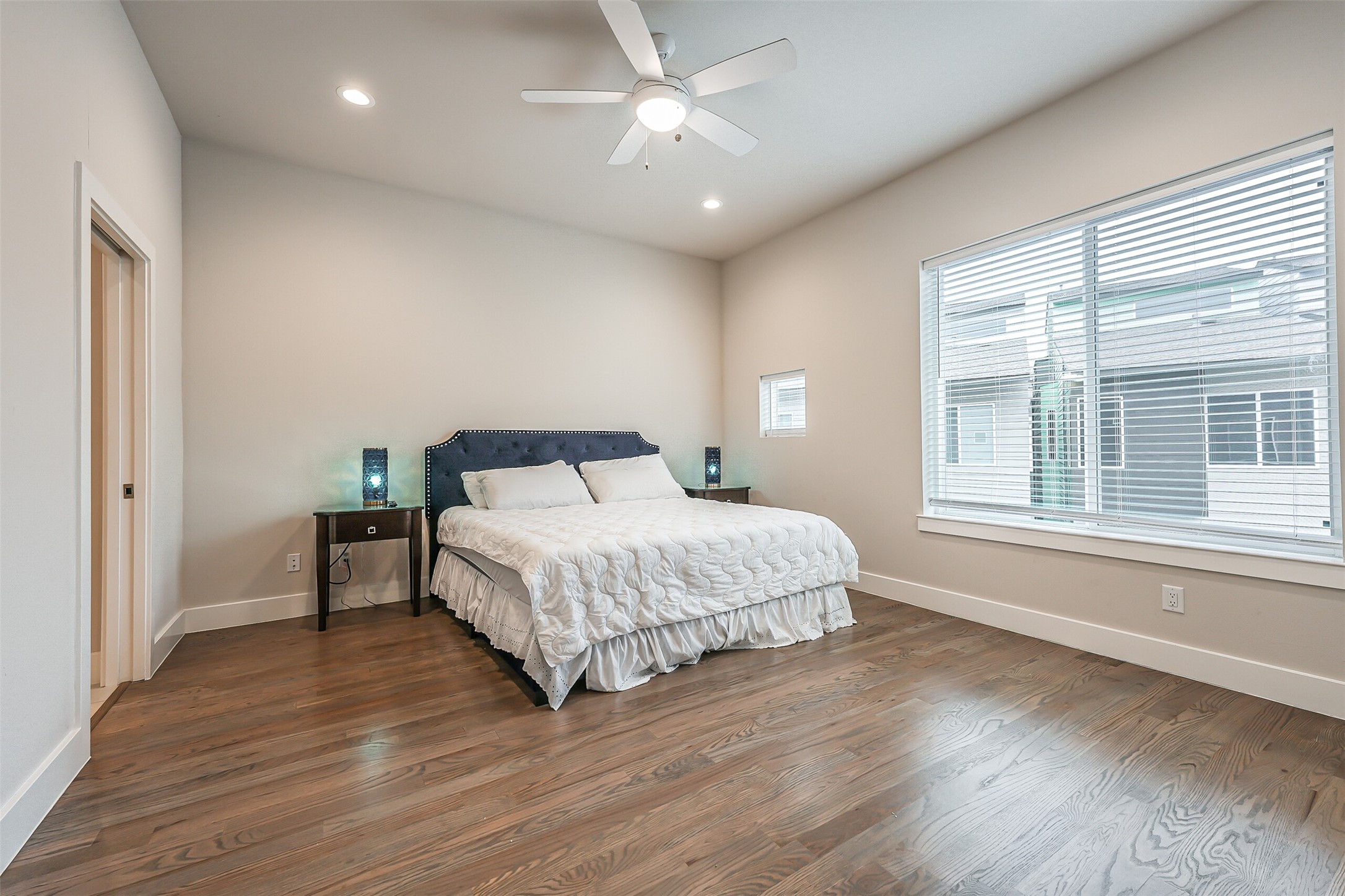 2136 Dennis Street Houston, TX 77004 - Photo 24 of 49 a bedroom with a bed and a large window