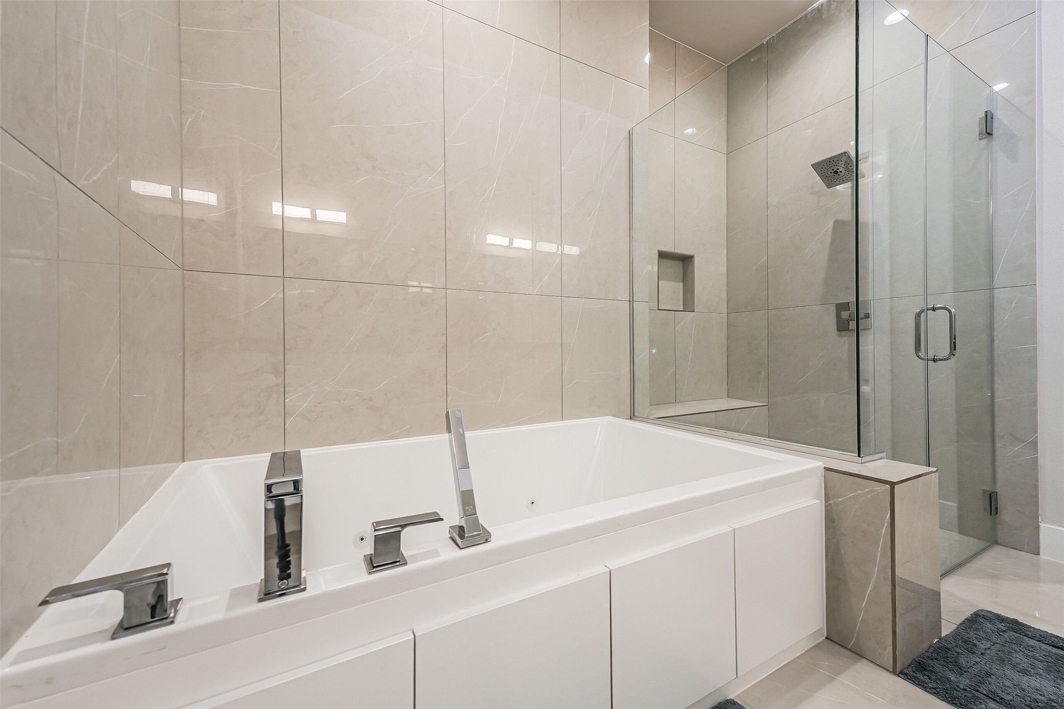 2136 Dennis Street Houston, TX 77004 - Photo 28 of 49 a bathroom with a tub and a sink