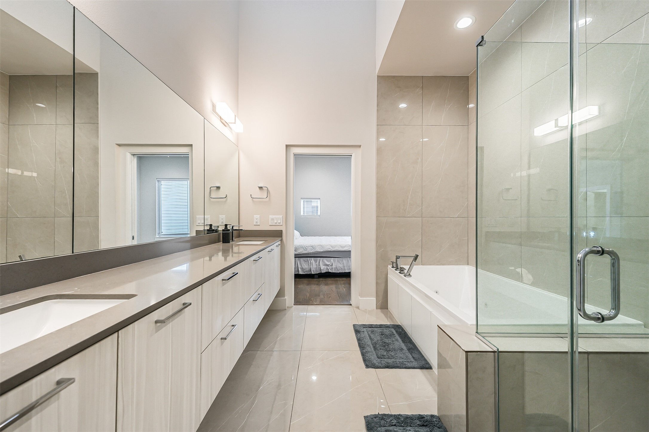 2136 Dennis Street Houston, TX 77004 - Photo 29 of 49 a spacious bathroom with a tub sink and mirror
