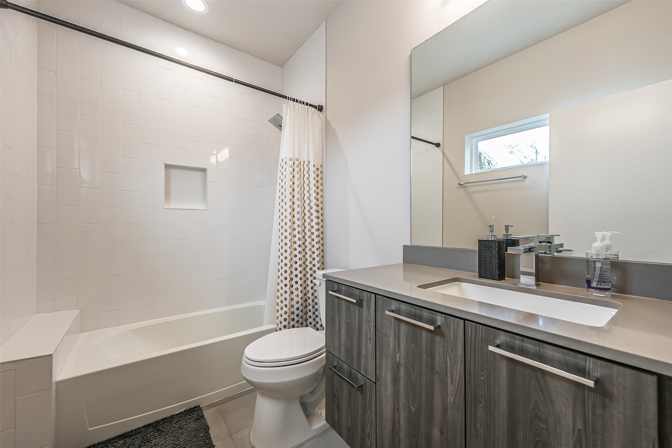 2136 Dennis Street Houston, TX 77004 - Photo 36 of 49 a bathroom with a granite countertop sink toilet and shower