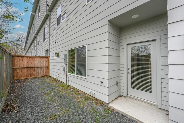 a front view of a building with a plants
