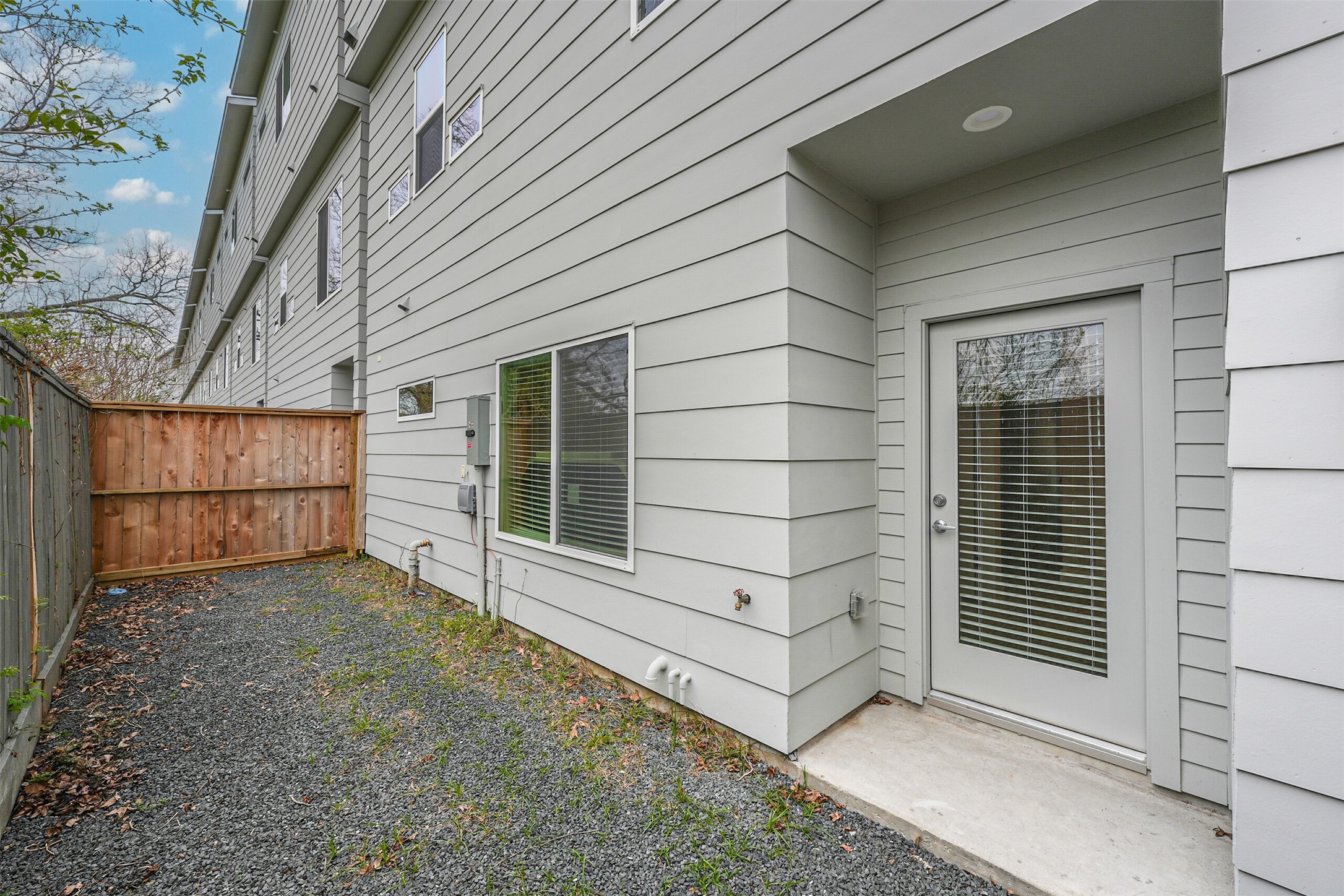2136 Dennis Street Houston, TX 77004 - Photo 44 of 49 a view of a house with a large window and wooden door