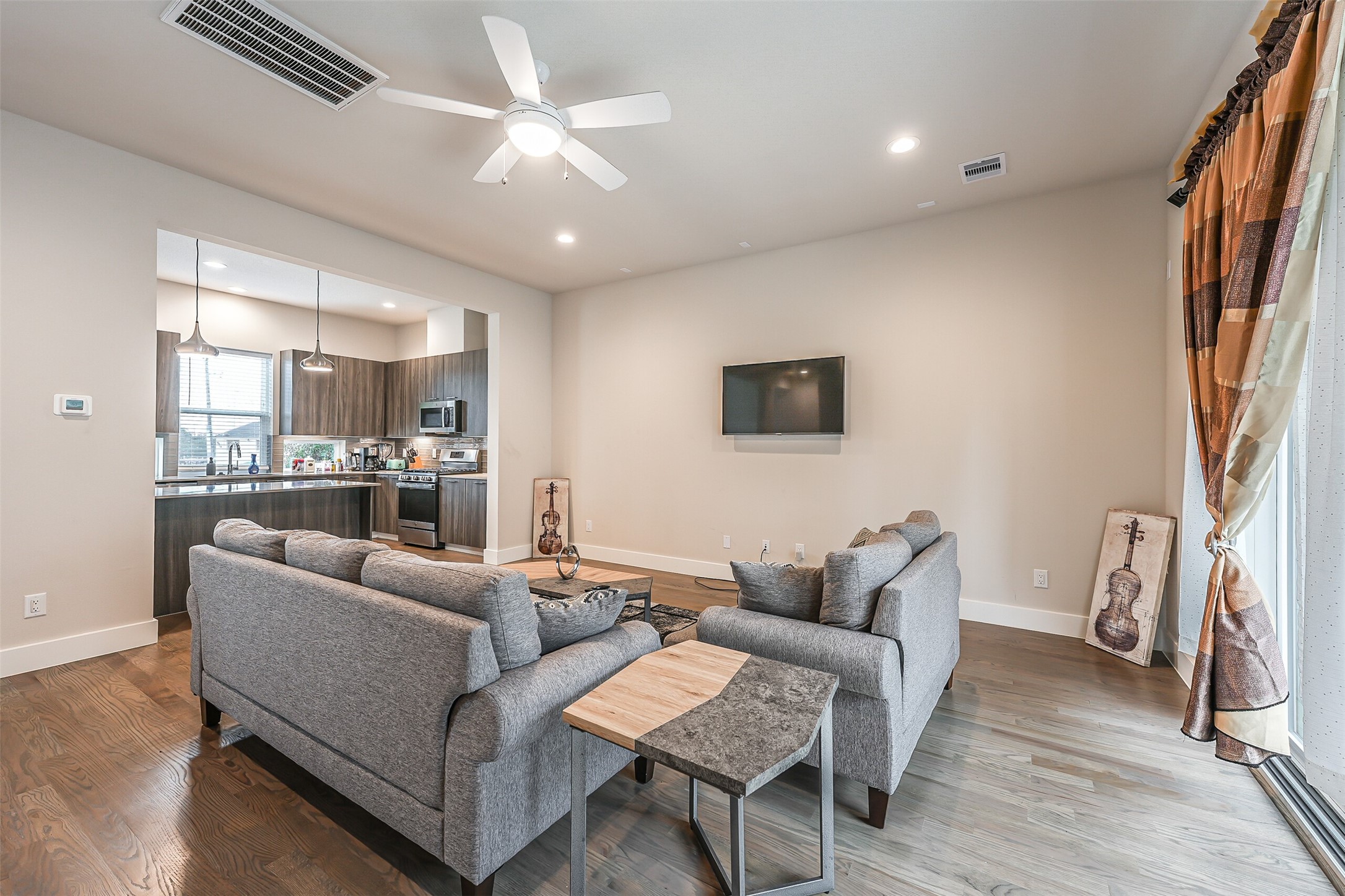2136 Dennis Street Houston, TX 77004 - Photo 6 of 49 a living room with furniture and a flat screen tv