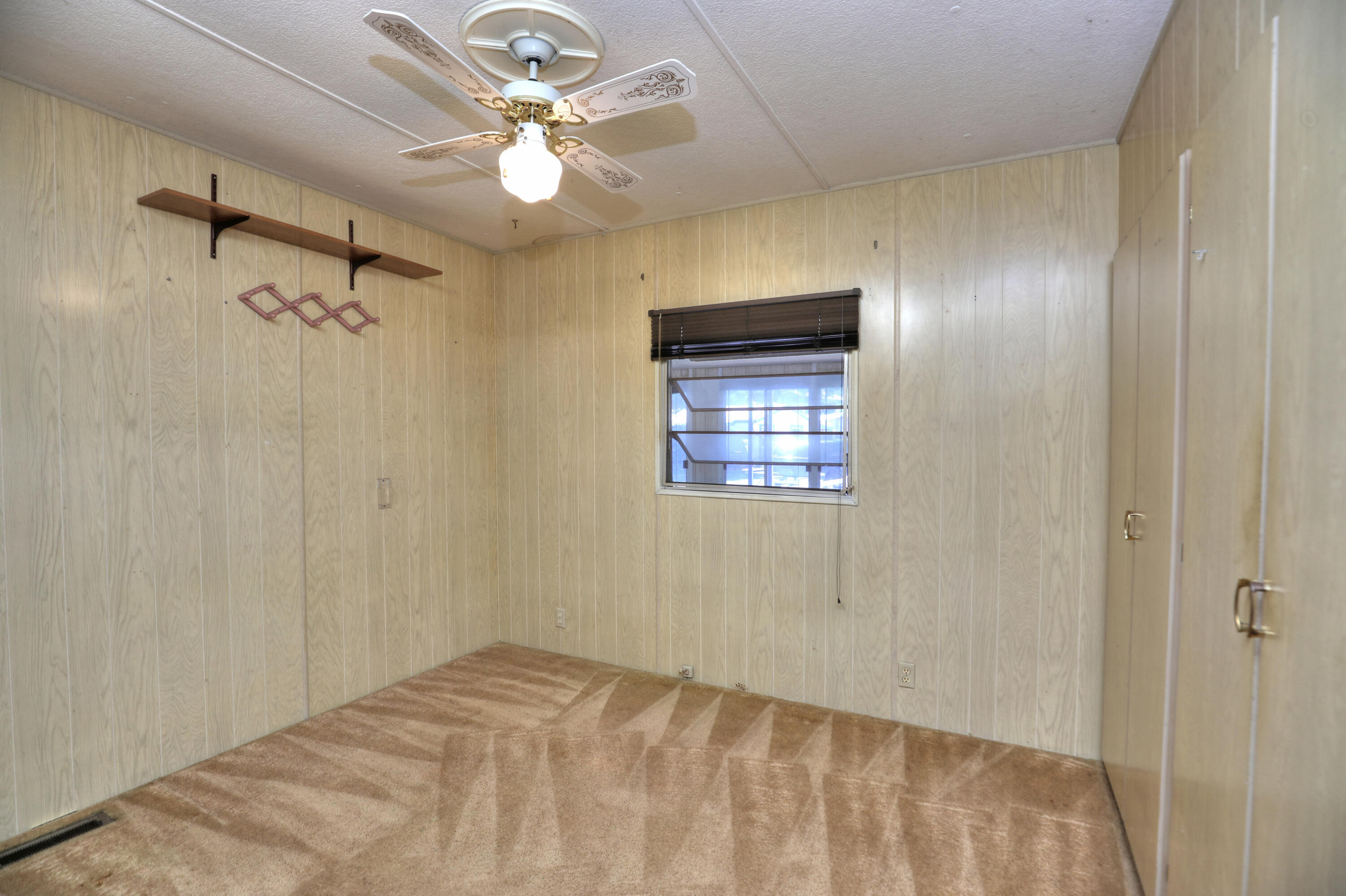 333 Old Mill Road, Unit 102 Santa Barbara, CA 93110 - Photo 11 of 16 a view of a bedroom with a ceiling fan and a window