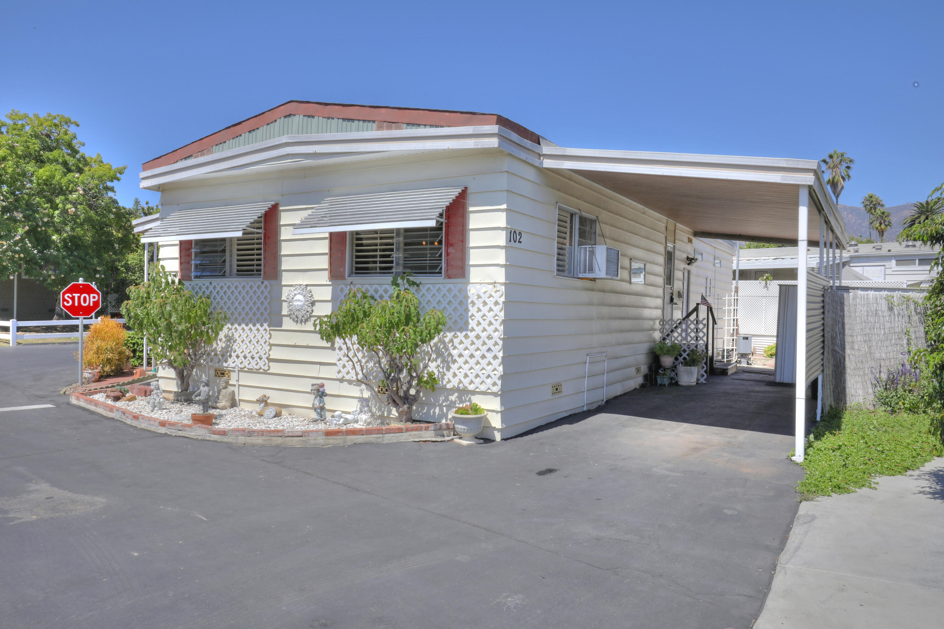 333 Old Mill Road, Unit 102 Santa Barbara, CA 93110 - Photo 13 of 16 a front view of a house with a yard
