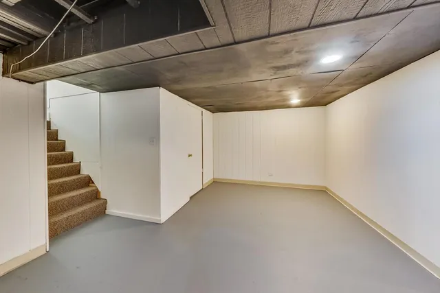 a view of an empty room with stairs