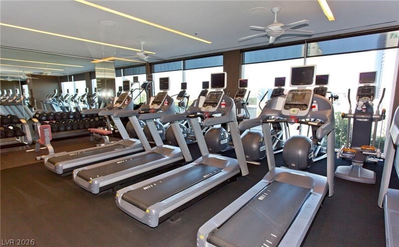 4381 West Flamingo Road, Unit 15310 Las Vegas, NV 89103 - Photo 40 of 52 Exercise room featuring floor to ceiling windows and a ceiling fan