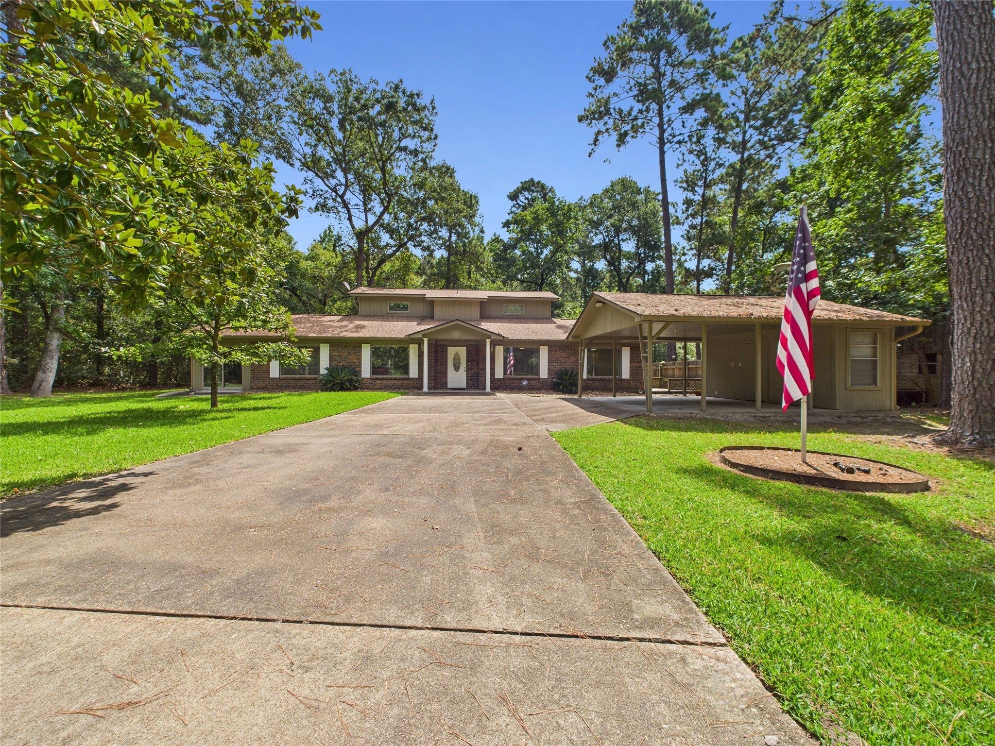 36 Corkwood Trinity, TX 75862 - Photo 1 of 49 a view of a house with a yard potted plants and large tree