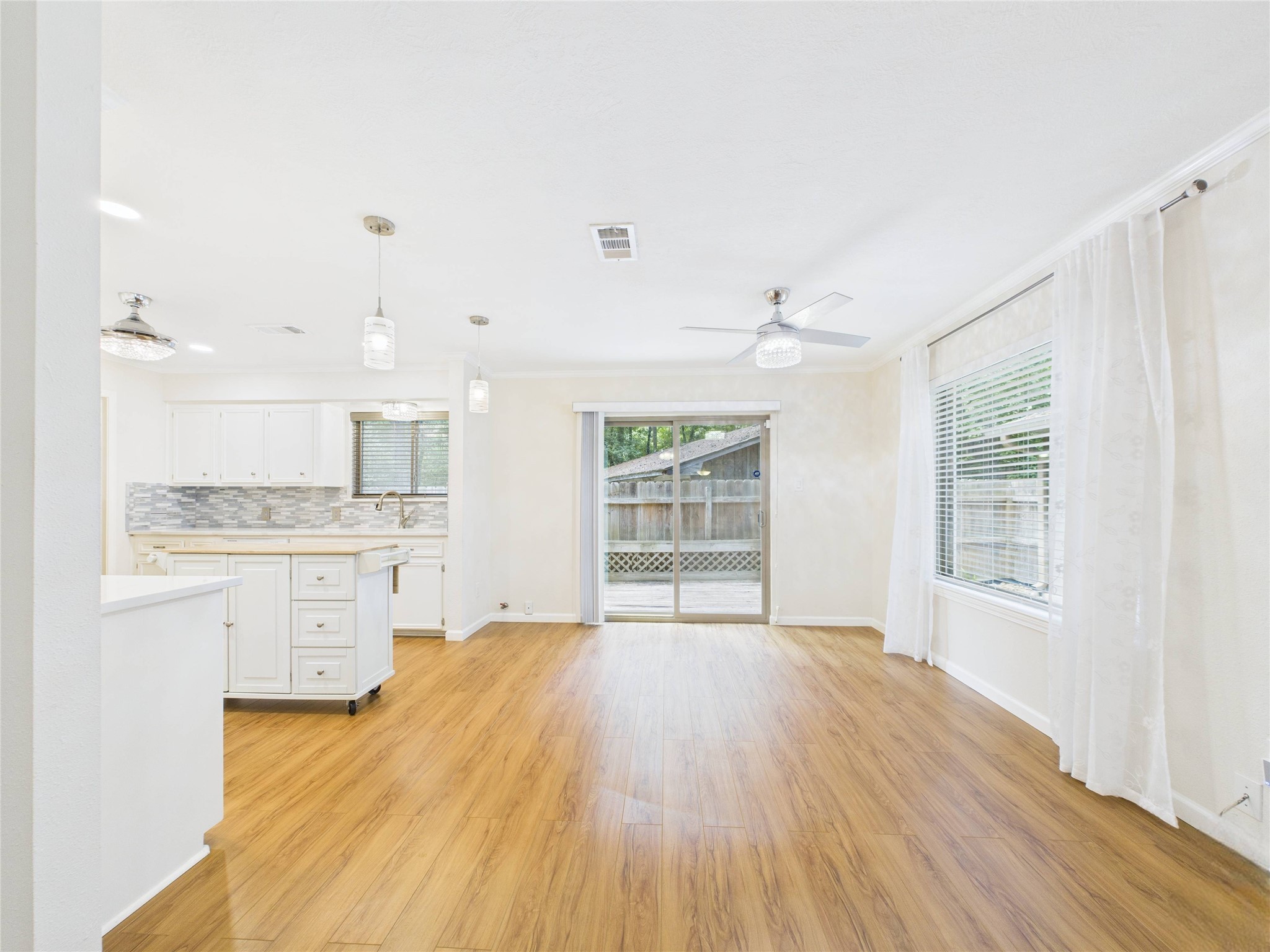 36 Corkwood Trinity, TX 75862 - Photo 12 of 49 Beautiful well lite living area looking into the breakfast and kitchen. New sliding glass door leading to the deck area.