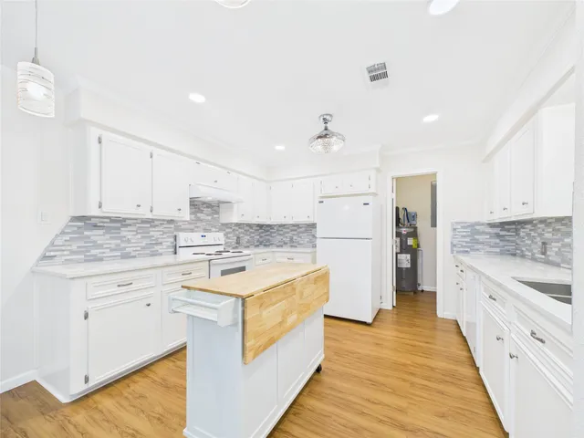 a view of storage and utility room with washer and dryer