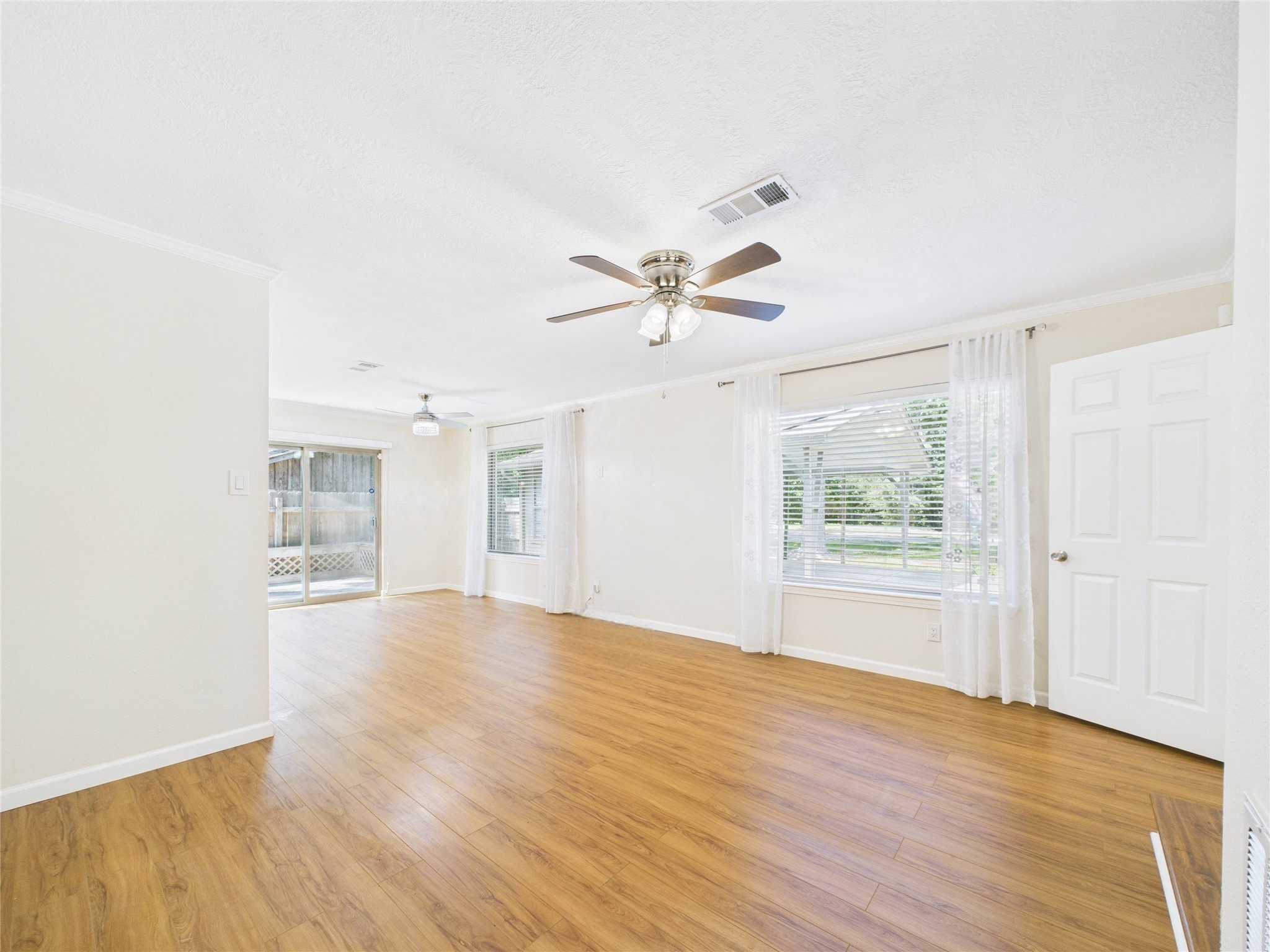 36 Corkwood Trinity, TX 75862 - Photo 23 of 49 a view of an empty room with a window and wooden floor