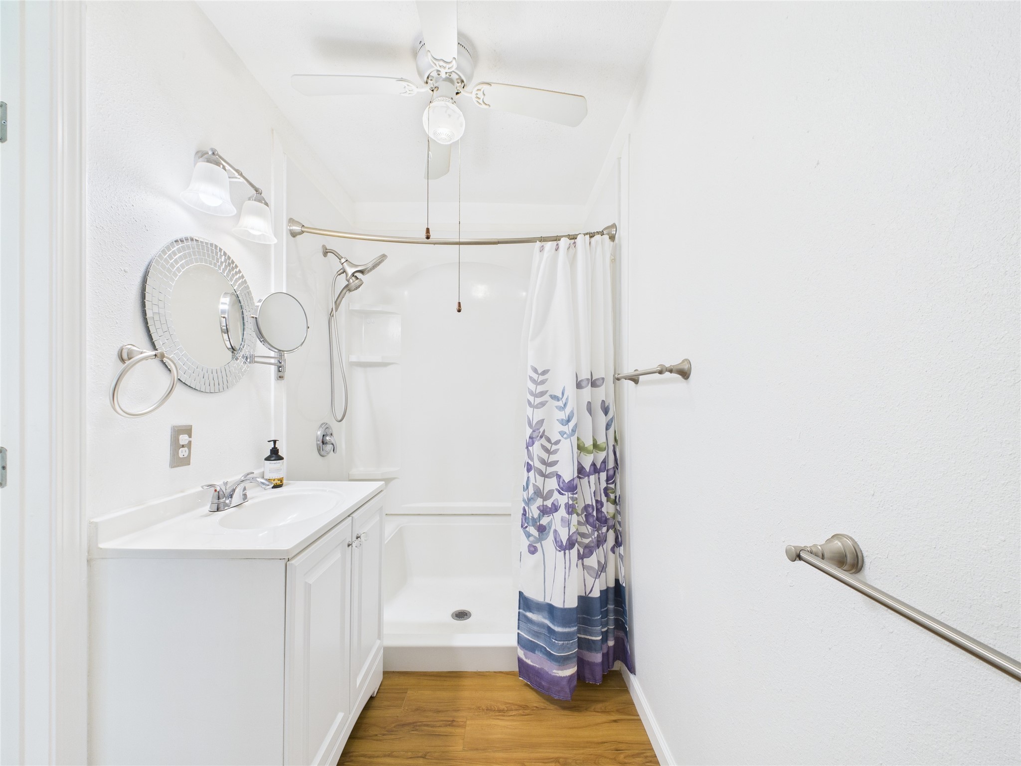 36 Corkwood Trinity, TX 75862 - Photo 40 of 49 a bathroom with a sink a mirror and a shower