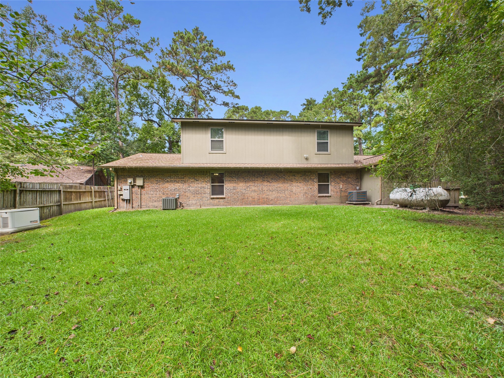 36 Corkwood Trinity, TX 75862 - Photo 7 of 49 a front view of a house with a garden and yard