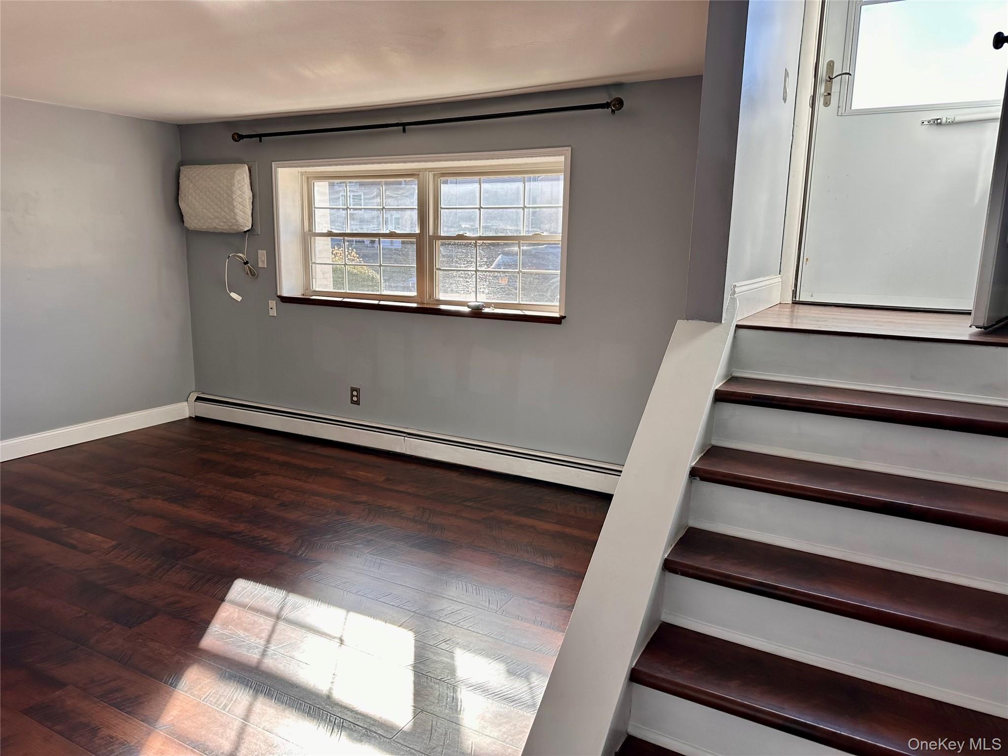 5 Forge Gate Drive, Unit C3 Cold Spring, NY 10516 - Photo 4 of 10 a view of an empty room with wooden floor and a window