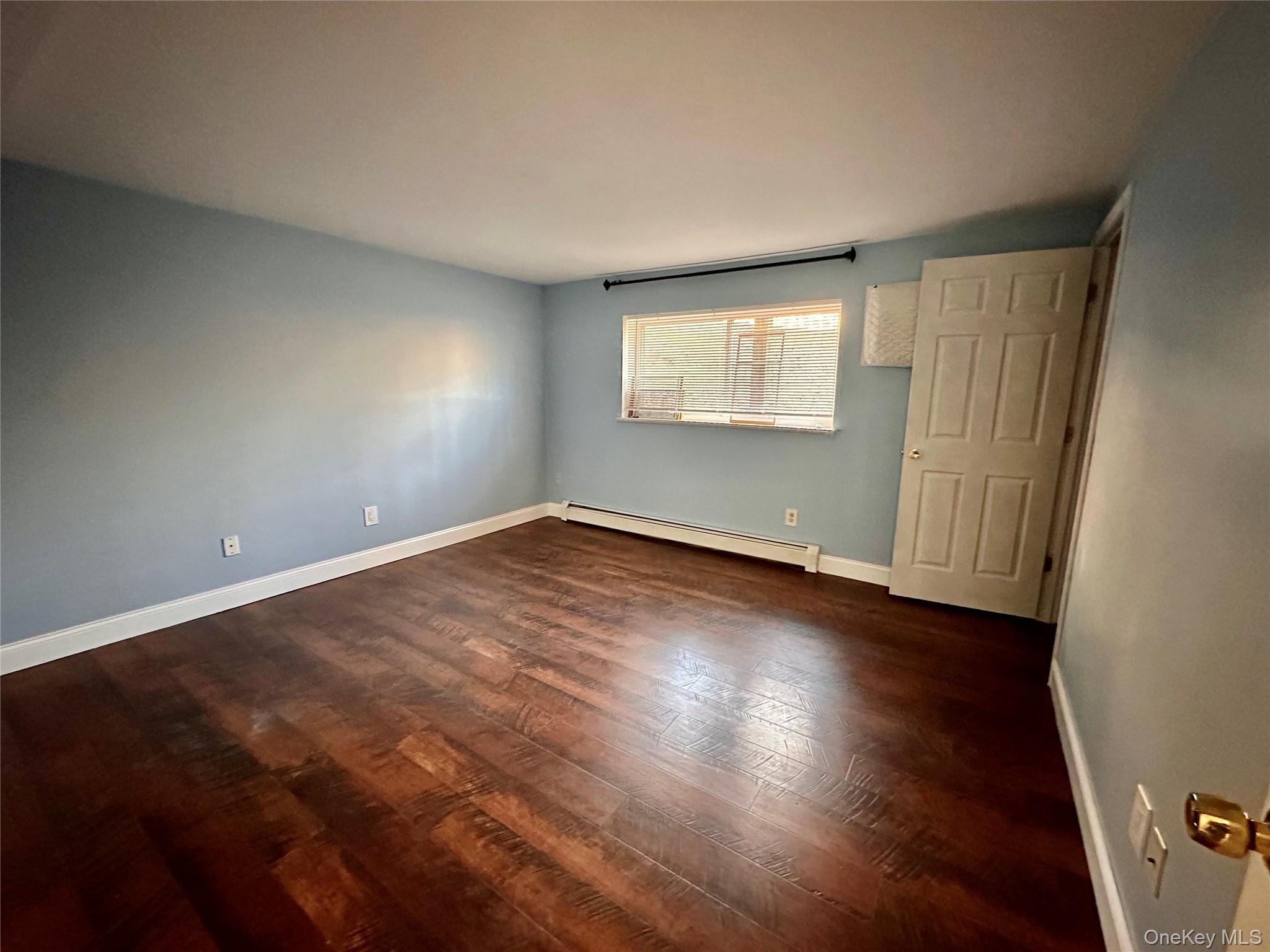 5 Forge Gate Drive, Unit C3 Cold Spring, NY 10516 - Photo 9 of 10 an empty room with wooden floor and windows