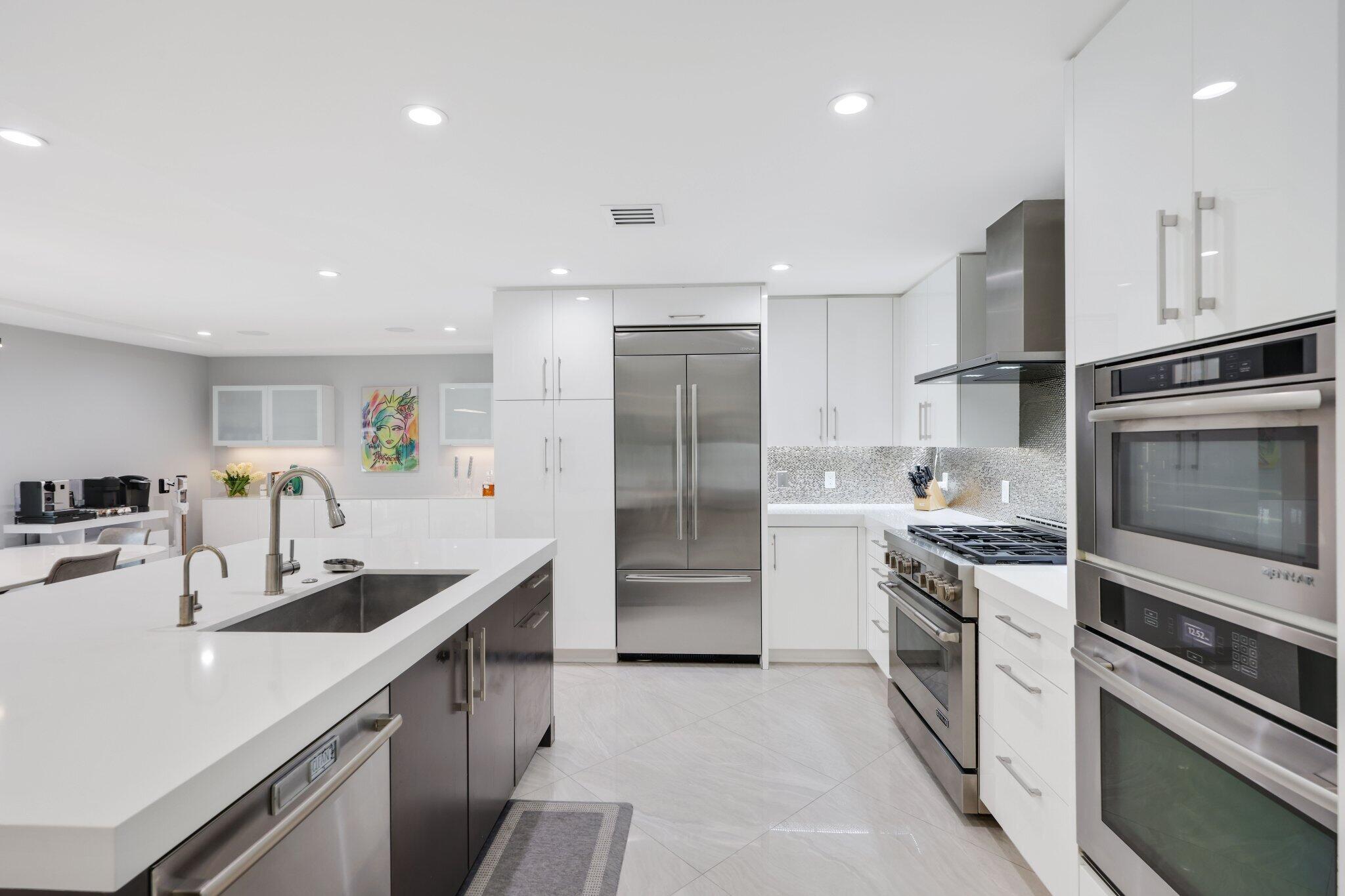 20984 Shady Vista Lane Boca Raton, FL 33428 - Photo 14 of 54 a kitchen with stainless steel appliances granite countertop a sink stove and refrigerator