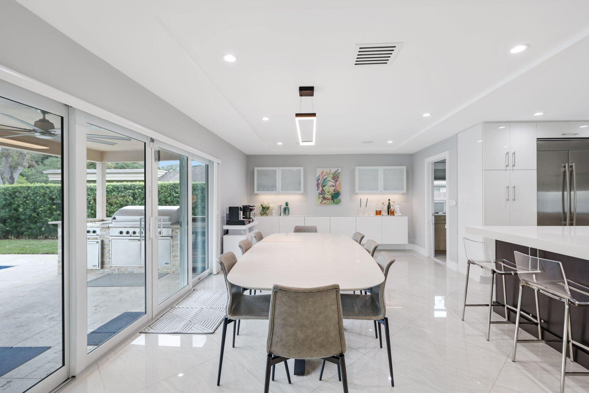 20984 Shady Vista Lane Boca Raton, FL 33428 - Photo 18 of 54 a view of a dining room with furniture window and wooden floor