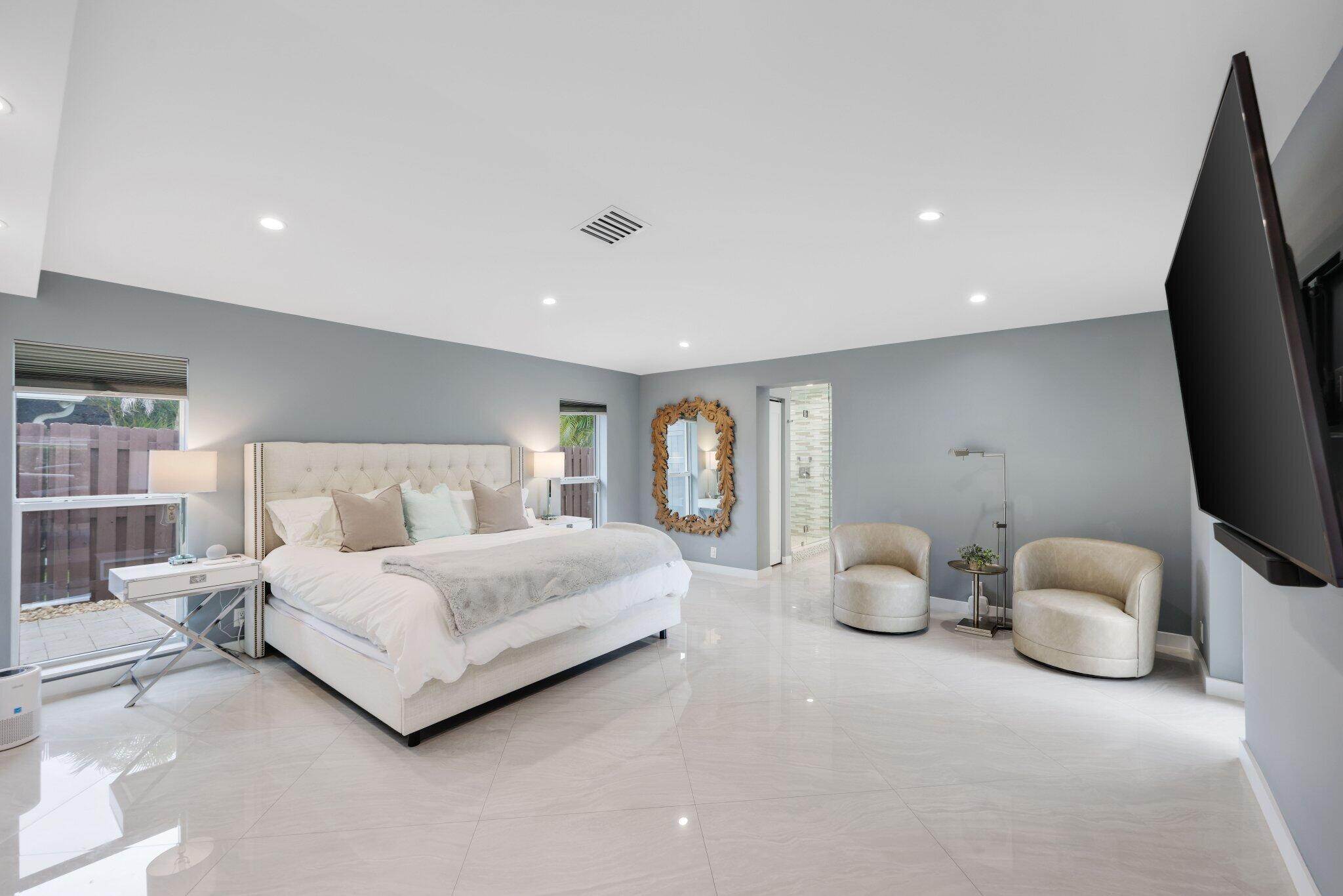 20984 Shady Vista Lane Boca Raton, FL 33428 - Photo 19 of 54 a bedroom with a bed and a flat tv screen