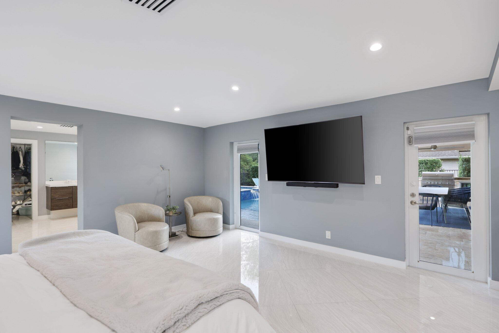 20984 Shady Vista Lane Boca Raton, FL 33428 - Photo 20 of 54 a living room with furniture and a flat screen tv