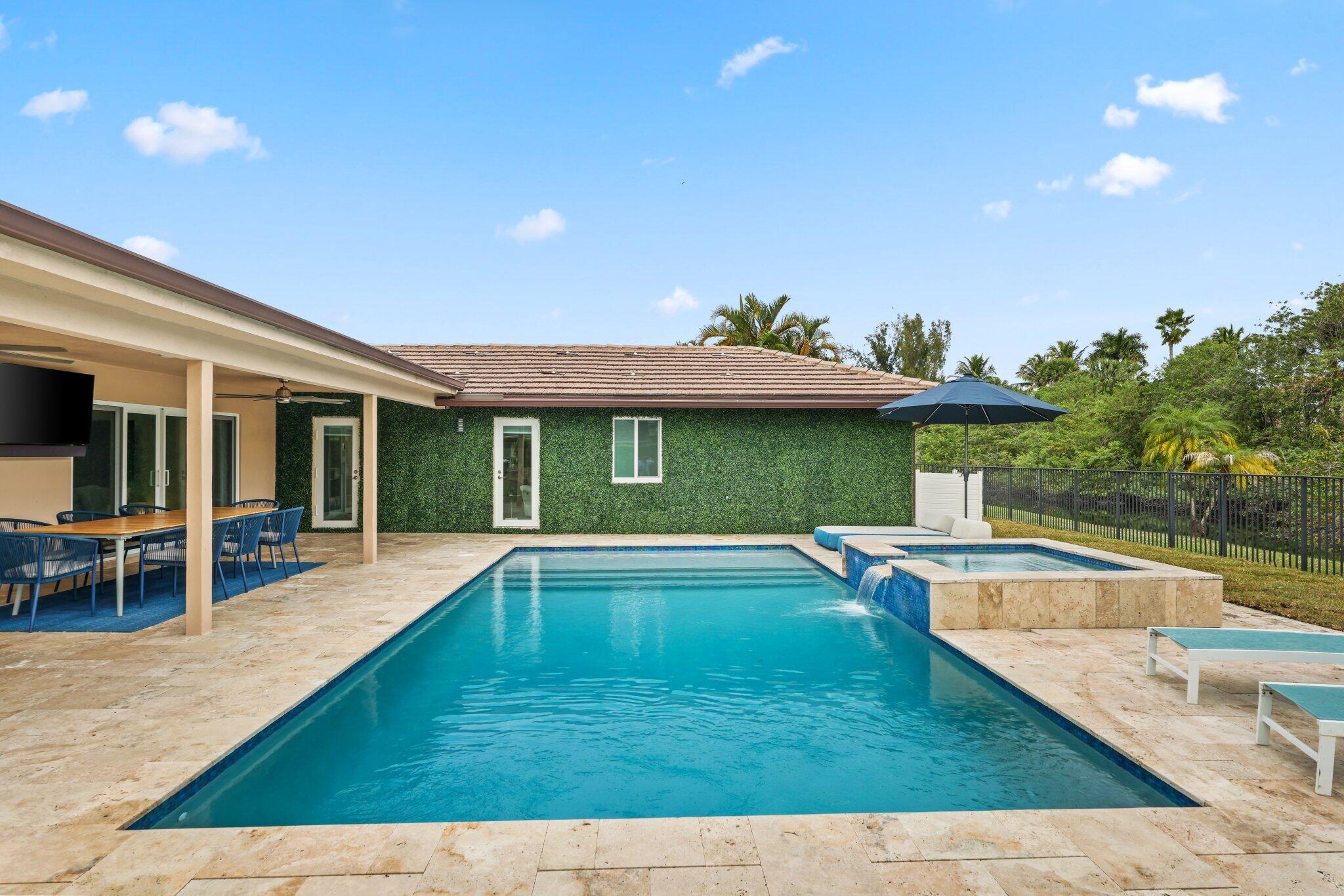 20984 Shady Vista Lane Boca Raton, FL 33428 - Photo 29 of 54 a view of a house with swimming pool and sitting area