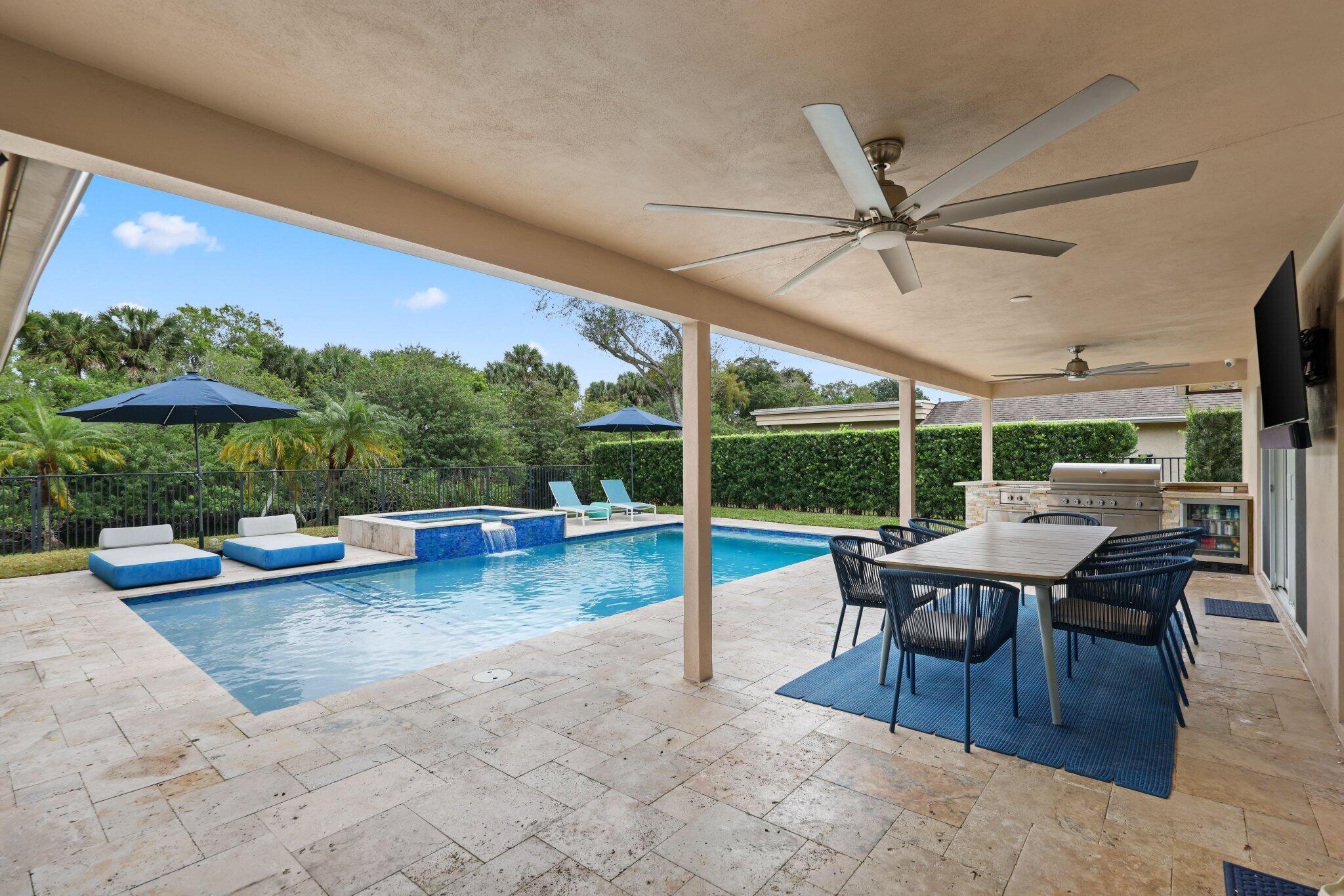 20984 Shady Vista Lane Boca Raton, FL 33428 - Photo 32 of 54 a view of a patio with a dining table and chairs