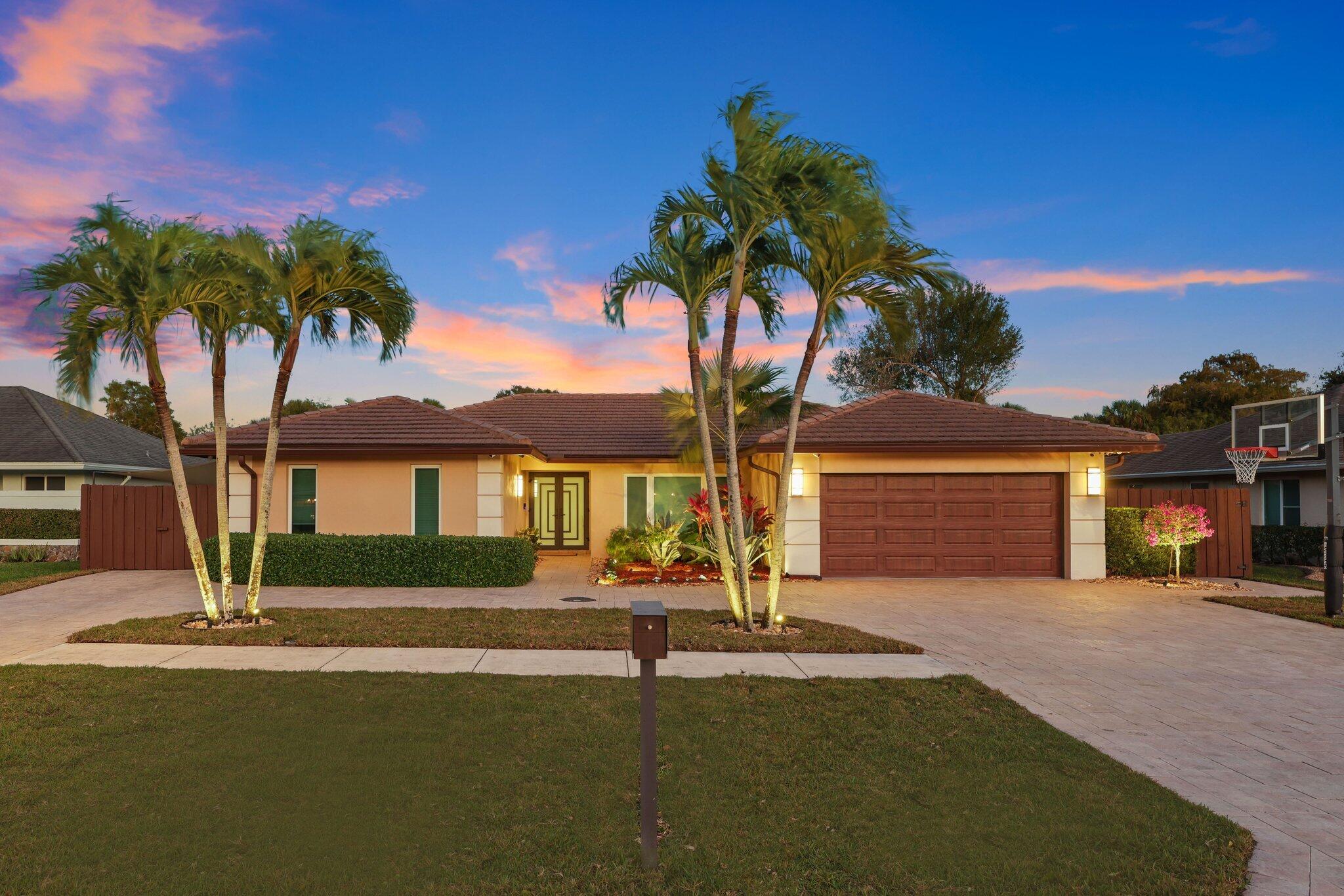 20984 Shady Vista Lane Boca Raton, FL 33428 - Photo 38 of 54 a front view of a house with a yard and palm tree