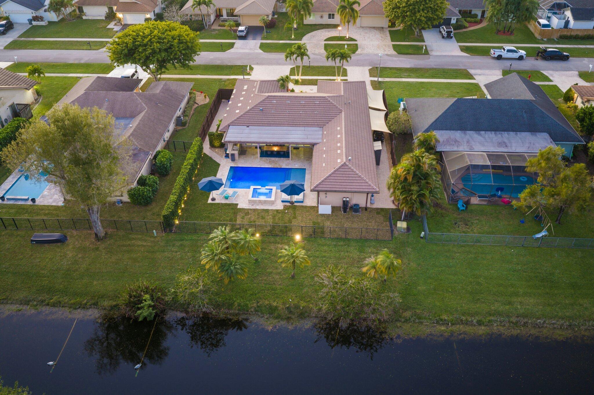 20984 Shady Vista Lane Boca Raton, FL 33428 - Photo 42 of 54 an aerial view of multiple houses with yard