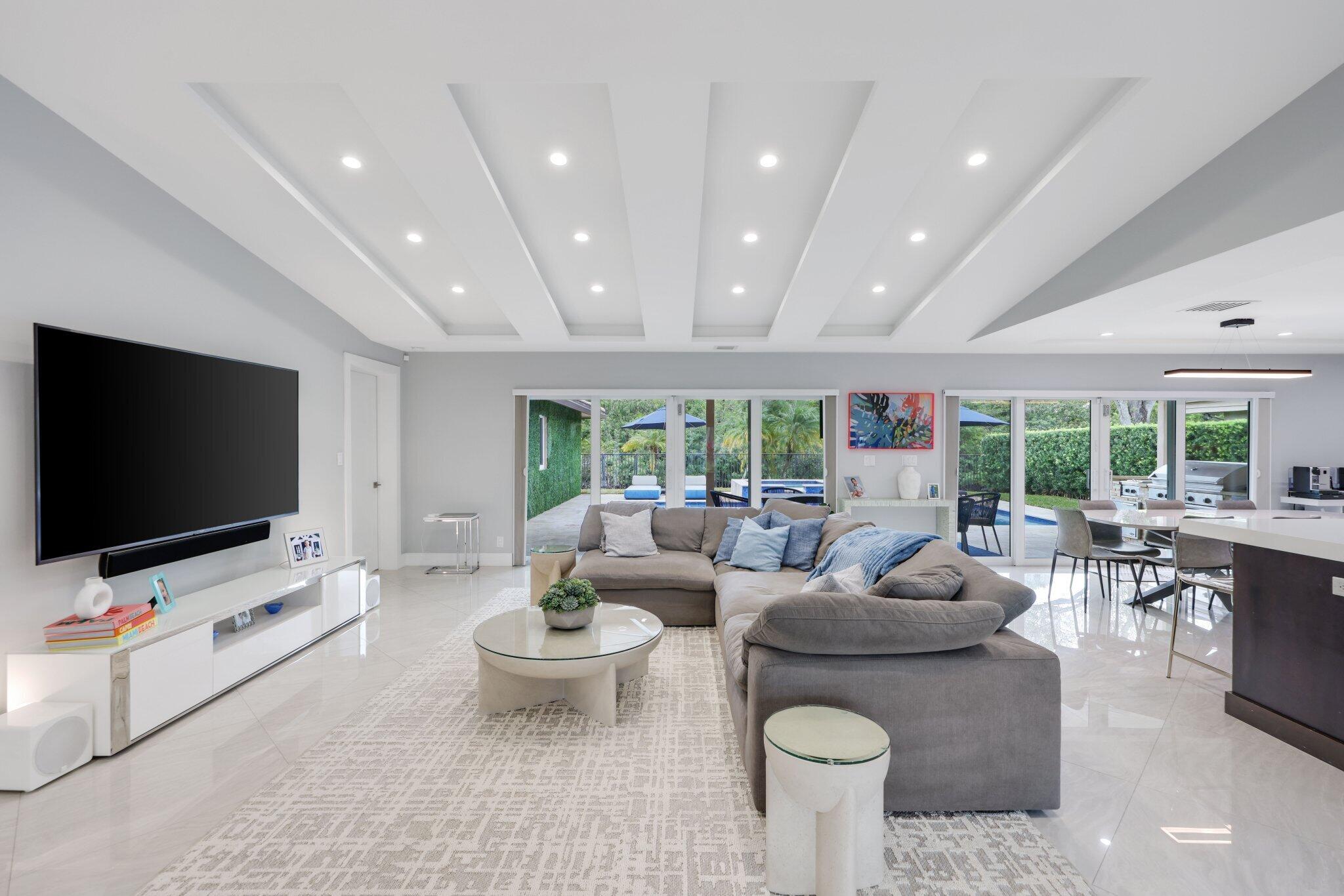 20984 Shady Vista Lane Boca Raton, FL 33428 - Photo 6 of 54 a living room with furniture and a flat screen tv