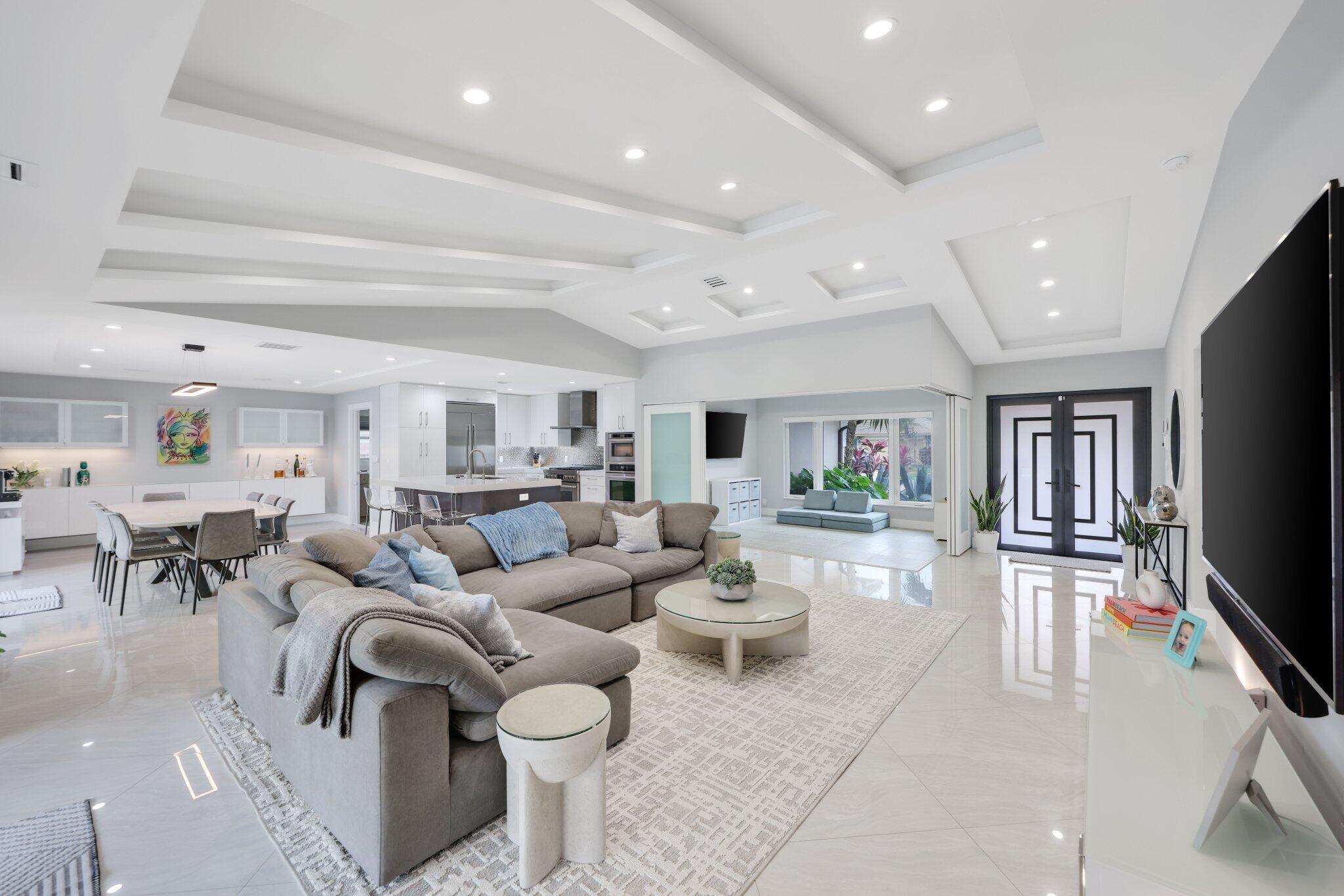 20984 Shady Vista Lane Boca Raton, FL 33428 - Photo 8 of 54 a living room with lots of furniture and a flat screen tv