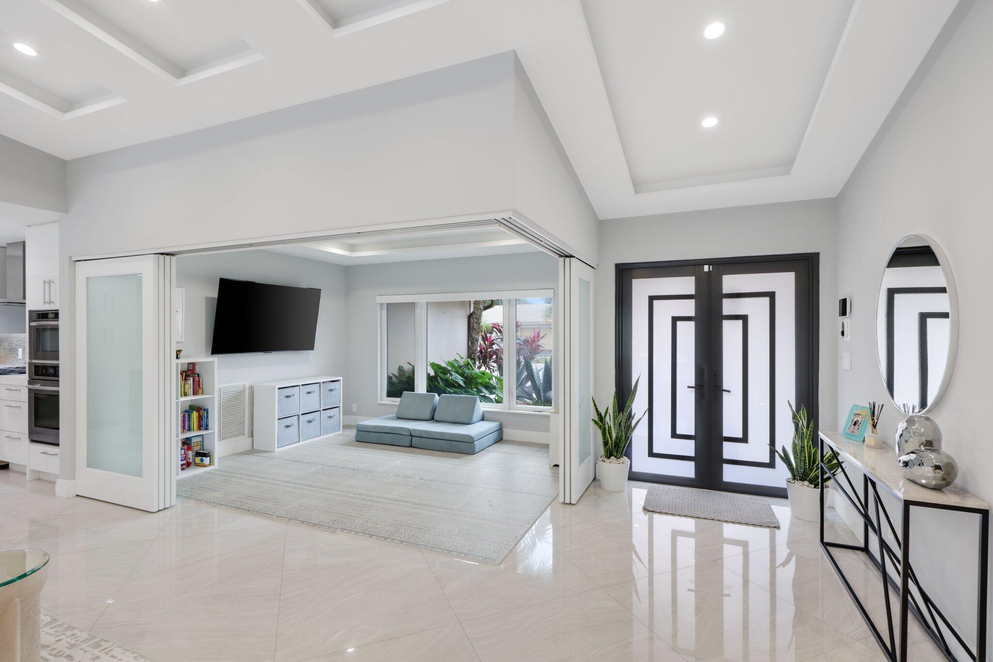 20984 Shady Vista Lane Boca Raton, FL 33428 - Photo 10 of 54 a living room with furniture and a flat screen tv