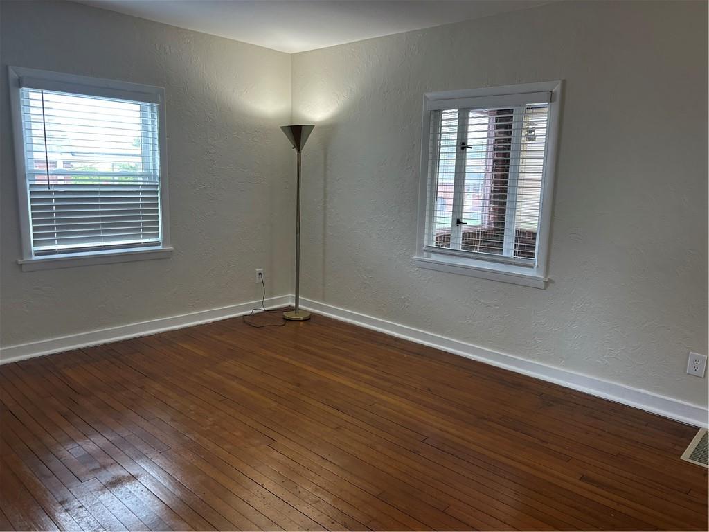 314 Terrace McKeesport, PA 15135 - Photo 7 of 19 an empty room with wooden floor and windows