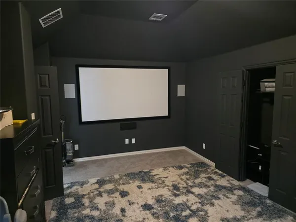 a bedroom with a bed and a bathroom