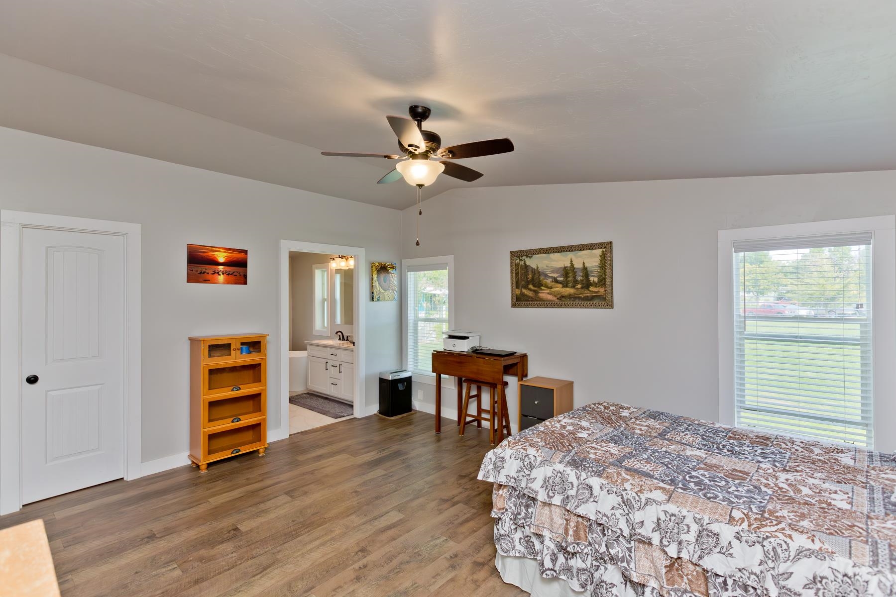 435 32 Road, Unit 601 Clifton, CO 81520 - Photo 19 of 38 a bedroom with a bed and a chandelier