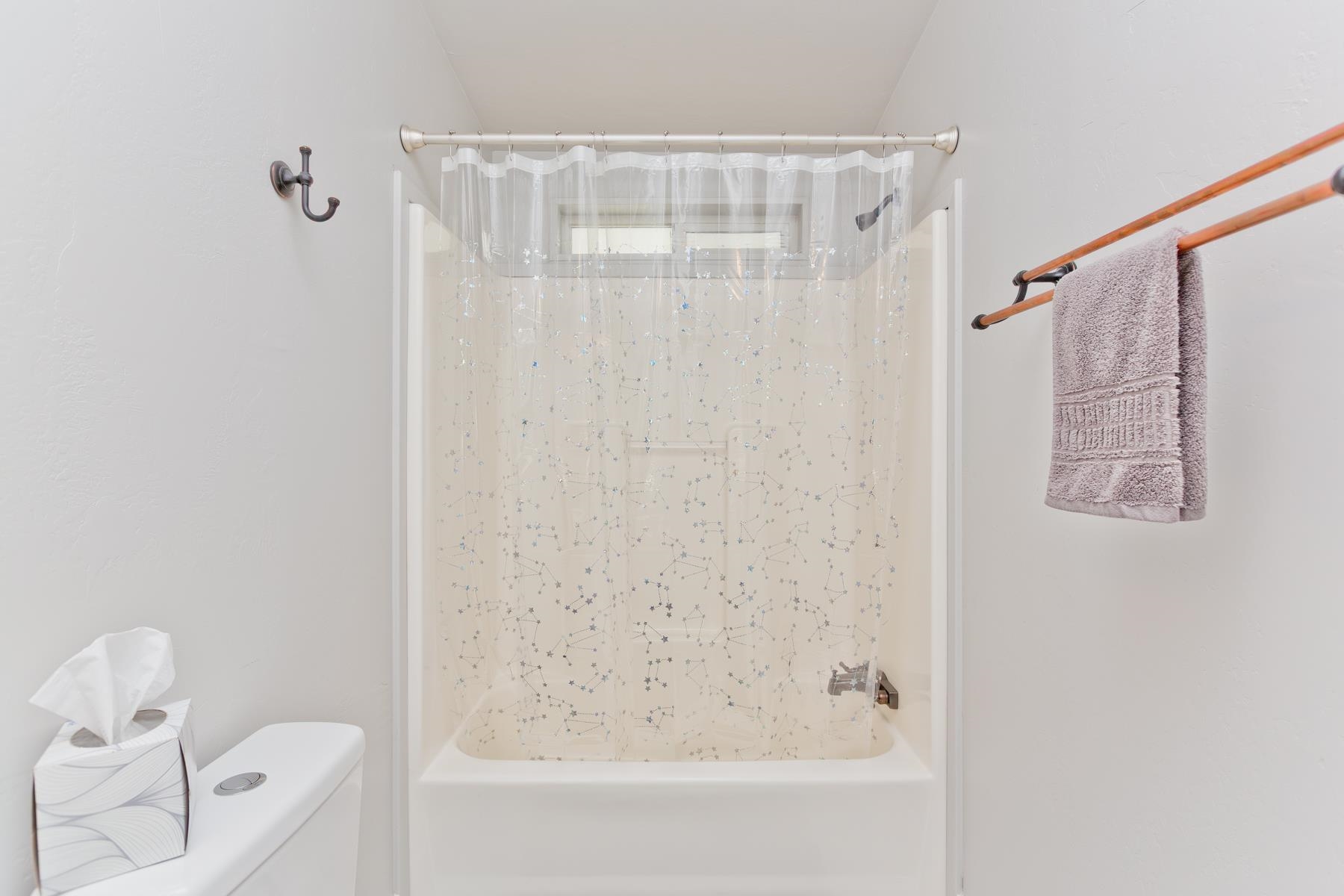 435 32 Road, Unit 601 Clifton, CO 81520 - Photo 27 of 38 a bathroom with a shower curtain and a bathtub