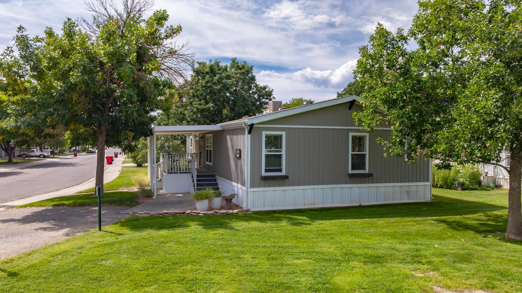 435 32 Road, Unit 601 Clifton, CO 81520 - Photo 3 of 38 a view of a house with backyard and a tree