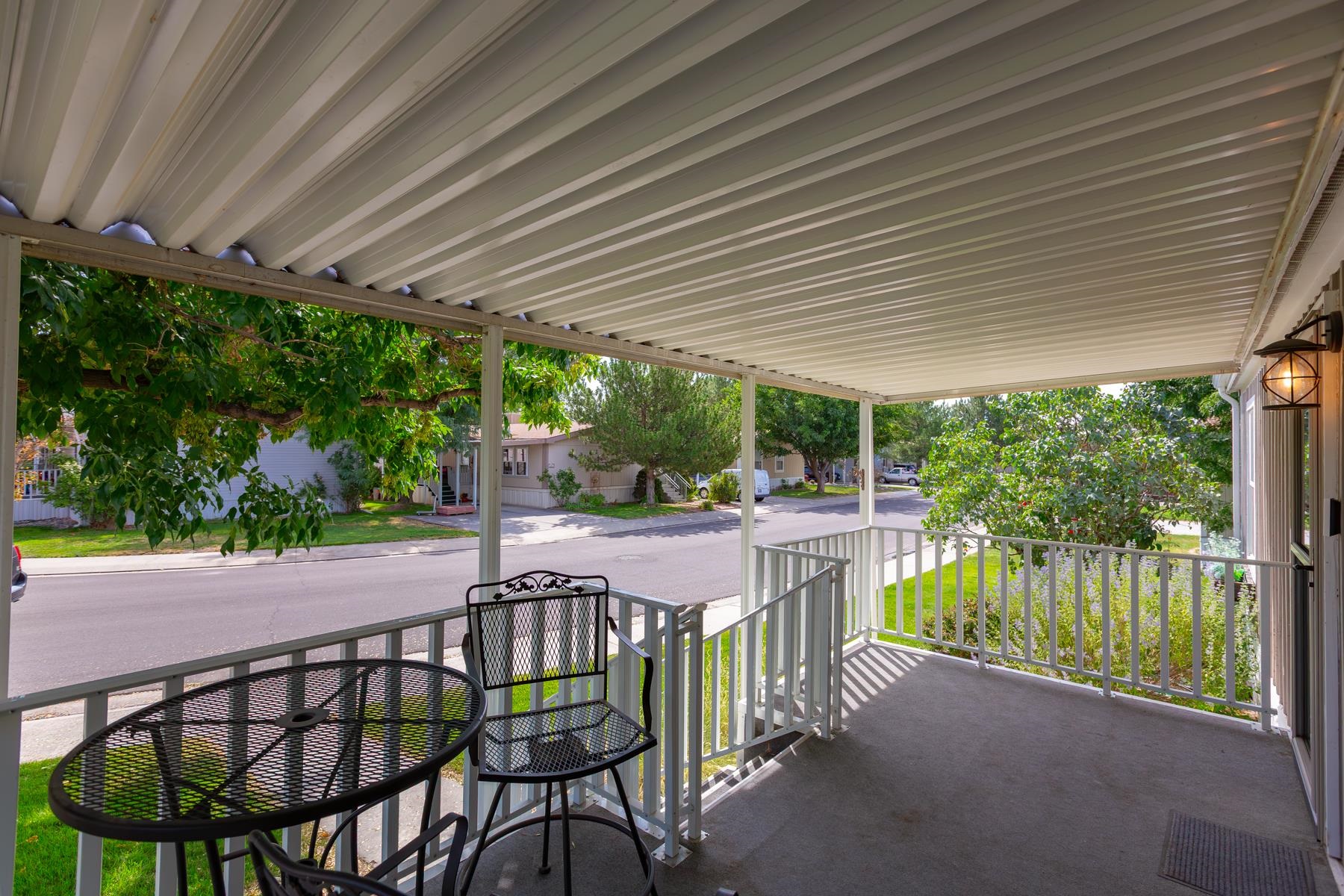 435 32 Road, Unit 601 Clifton, CO 81520 - Photo 6 of 38 a patio with water table and chairs