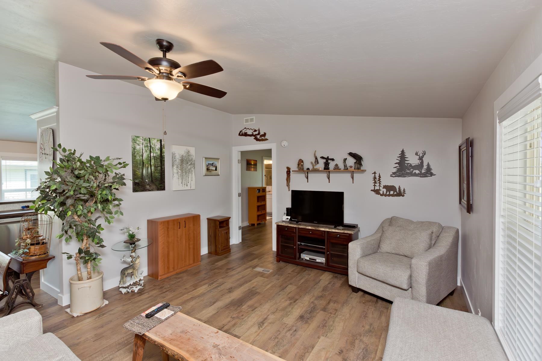 435 32 Road, Unit 601 Clifton, CO 81520 - Photo 8 of 38 a living room with furniture a fireplace and a flat screen tv