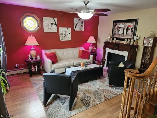 a living room with furniture and a fireplace
