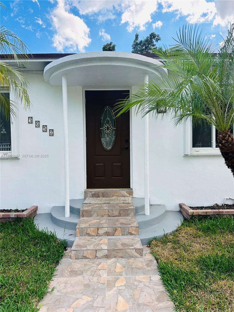 3052 Southwest 6th Street Miami, FL 33135 - Photo 2 of 15 a front view of a house with garden