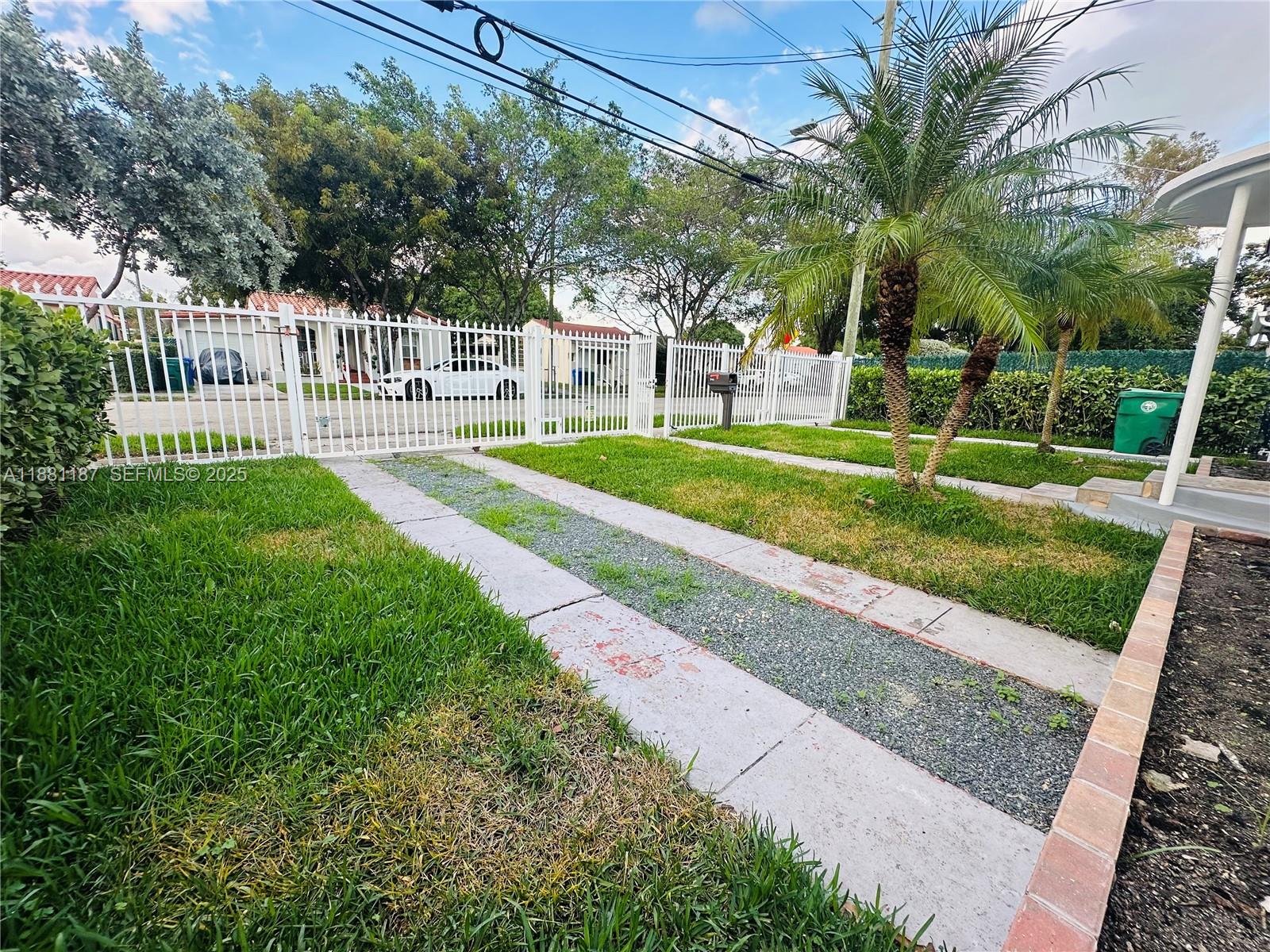 3052 Southwest 6th Street Miami, FL 33135 - Photo 5 of 15 a view of a house with a yard