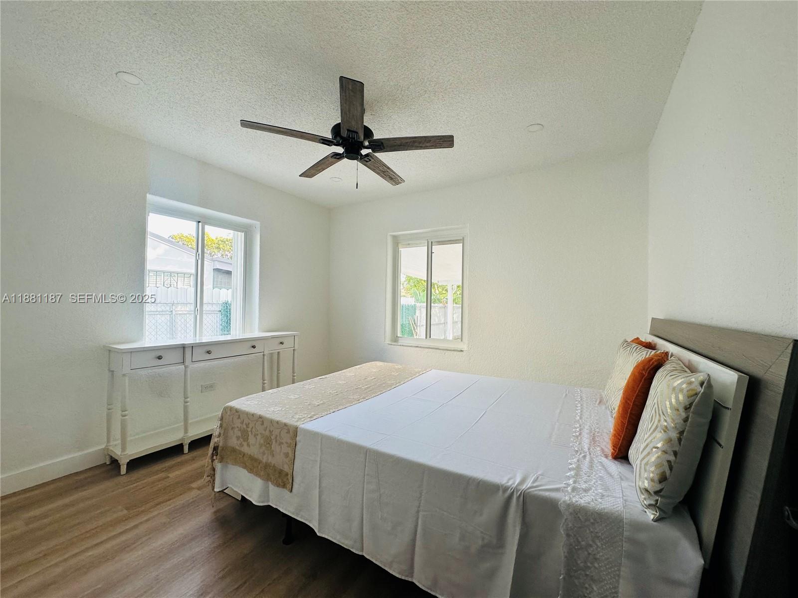 3052 Southwest 6th Street Miami, FL 33135 - Photo 9 of 15 a bedroom with a bed and a window