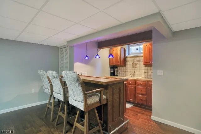 a view of a dining room with furniture and window
