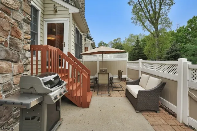 a view of a patio with furniture and a table