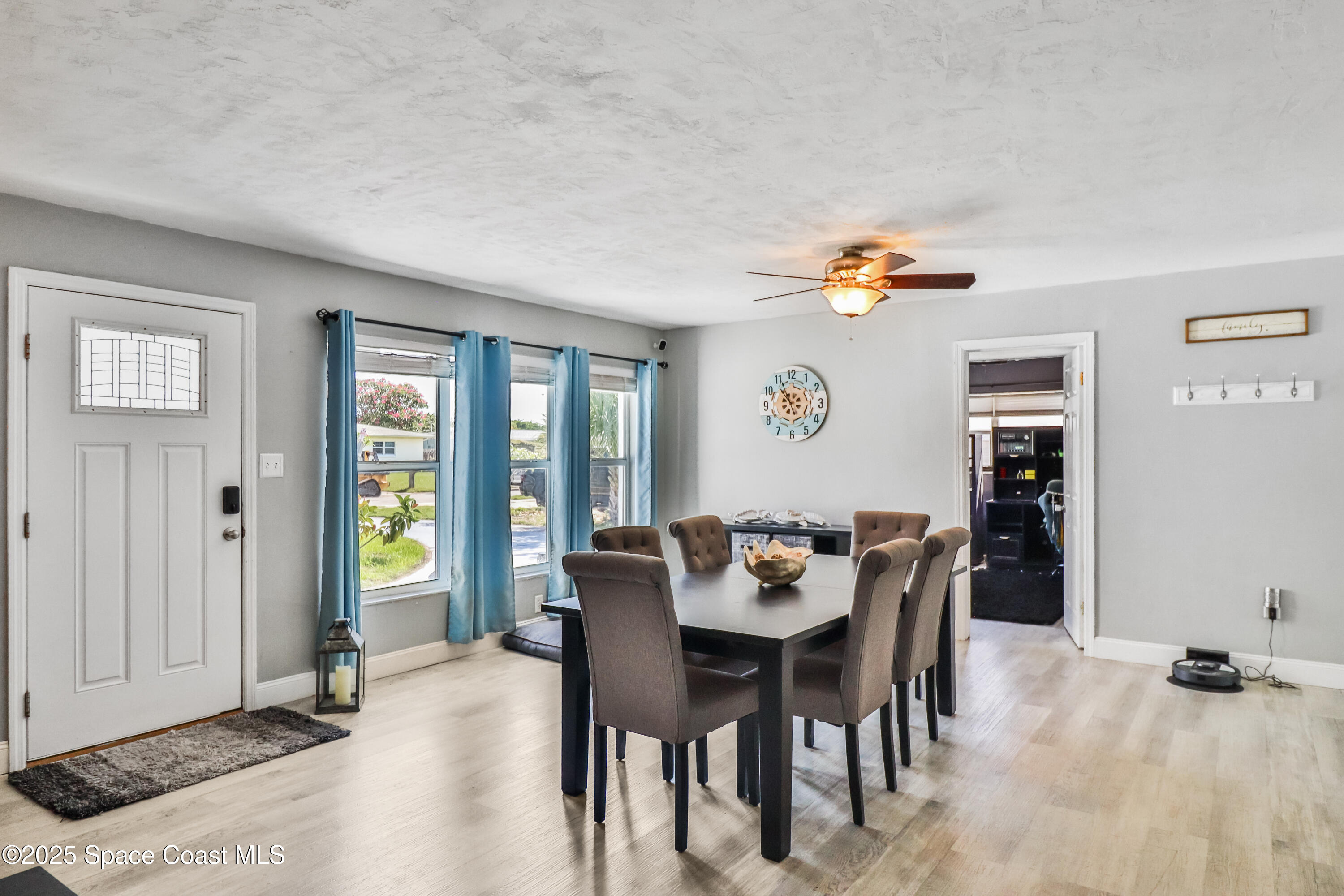 348 Berkeley Street Satellite Beach, FL 32937 - Photo 11 of 46 a dining room with furniture and window